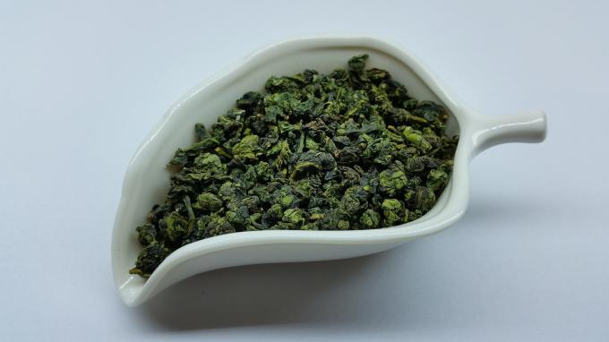 Το τσάι ενεργειακού Tieguanyin Oolong ώθησης, ανακατώνει - τηγανισμένος κινεζικός δεσμός Guan Yin τσαγιού